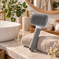 Brosse de toilettage autonettoyante